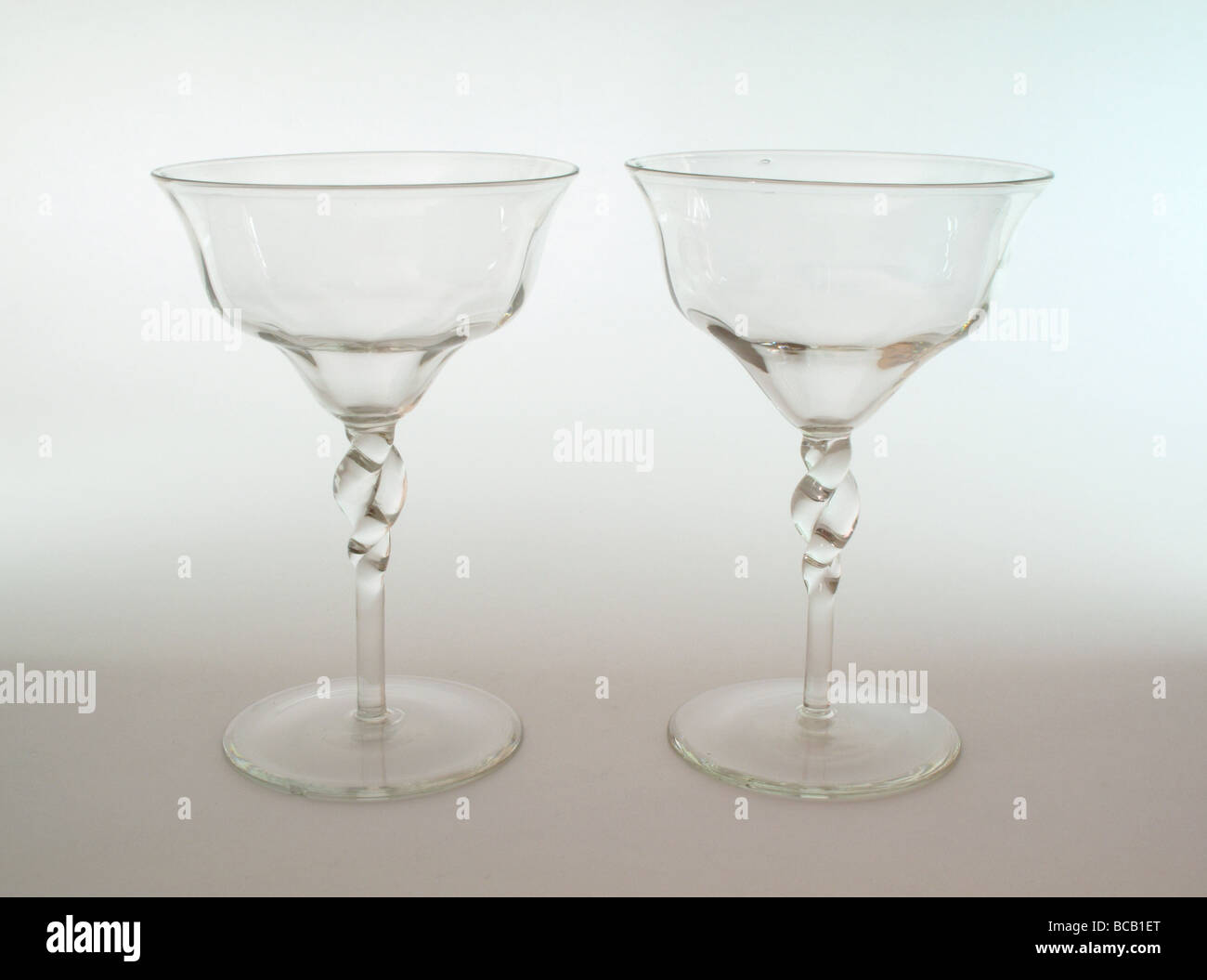 Arts and Crafts Whitefriars pair of champagne glasses designed by Harry Powell Stock Photo
