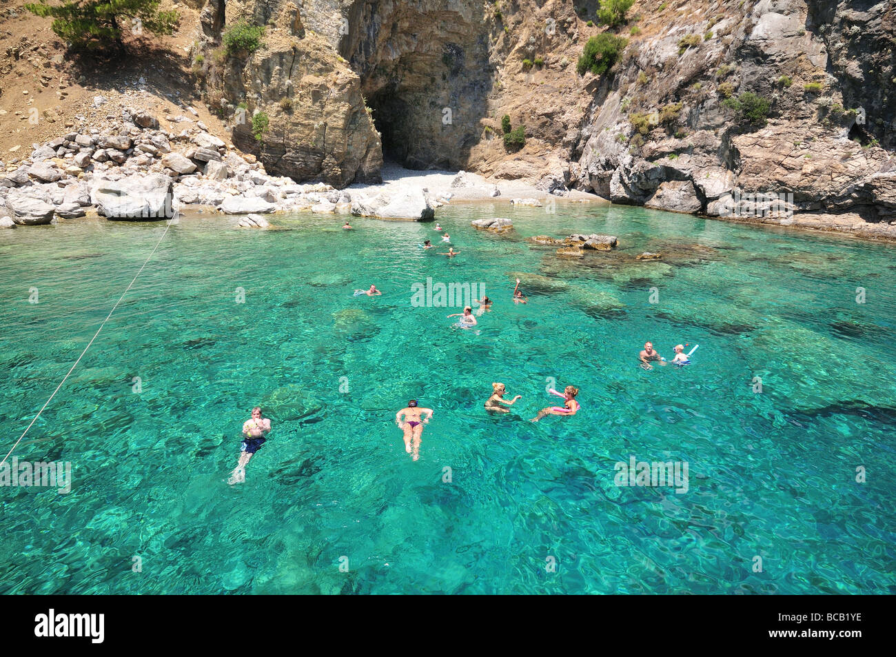 Swimmer in the crystal clear blue-green sea waters, southern Turkey