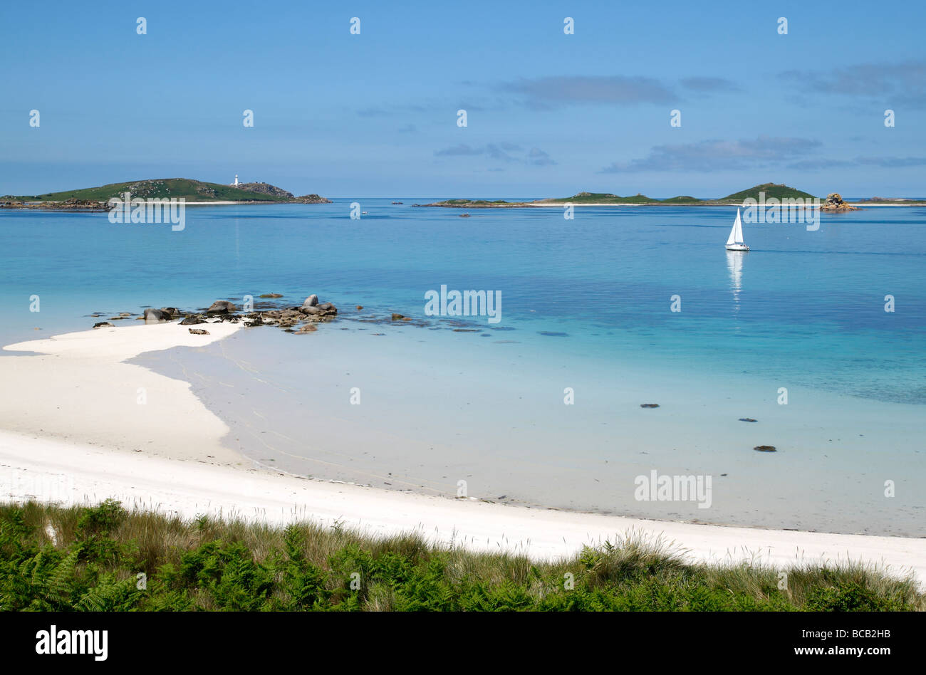 A beautiful white sandy beach and turquoise sea, Tresco Isles of Scilly, Cornwall UK. Stock Photo