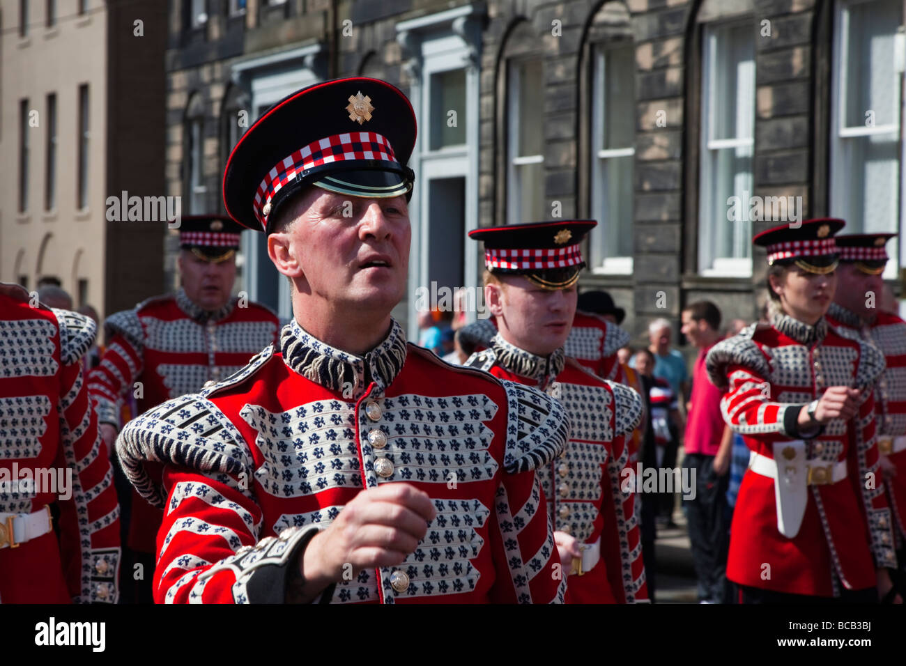 Member of the Black Skull Corps of Fife and Drums marching at the