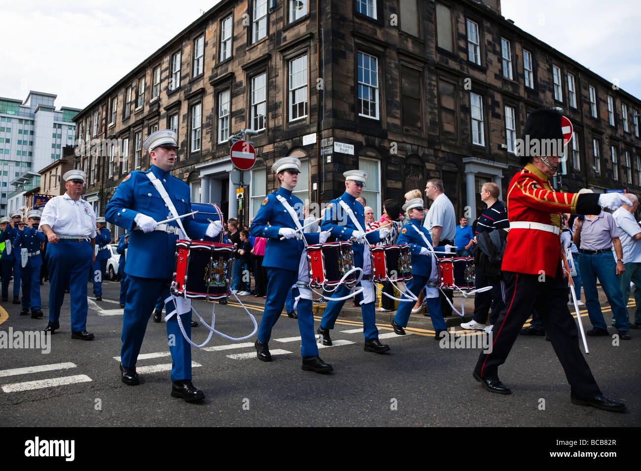 Members of the Kirkintilloch Young Conquerors flute and drum band marching at the Annual Orange Walk in Glasgow Scotland Stock Photo