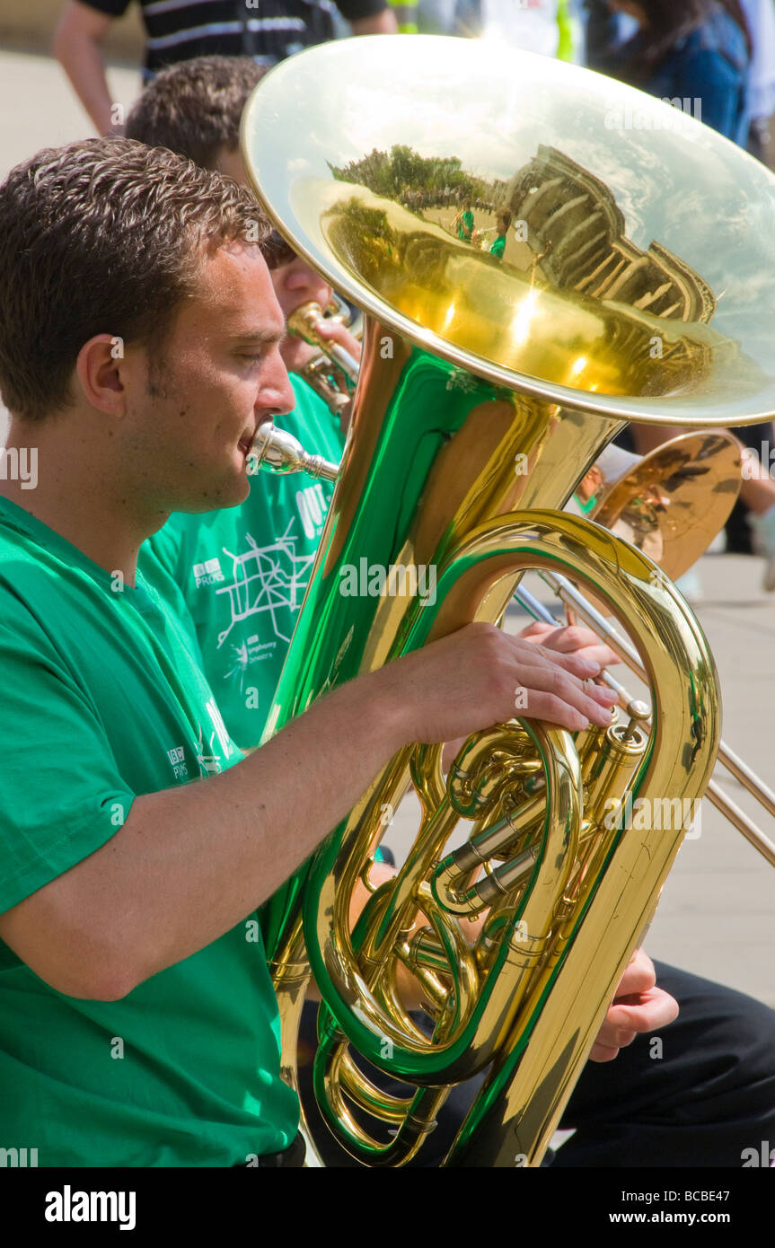 Tuba player in a brass band, playing in an outdoor summer concert. Stock Photo