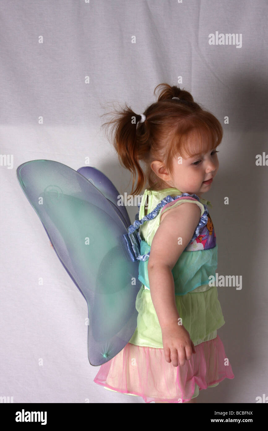 Young girl with red hair dressed as a fairy Stock Photo