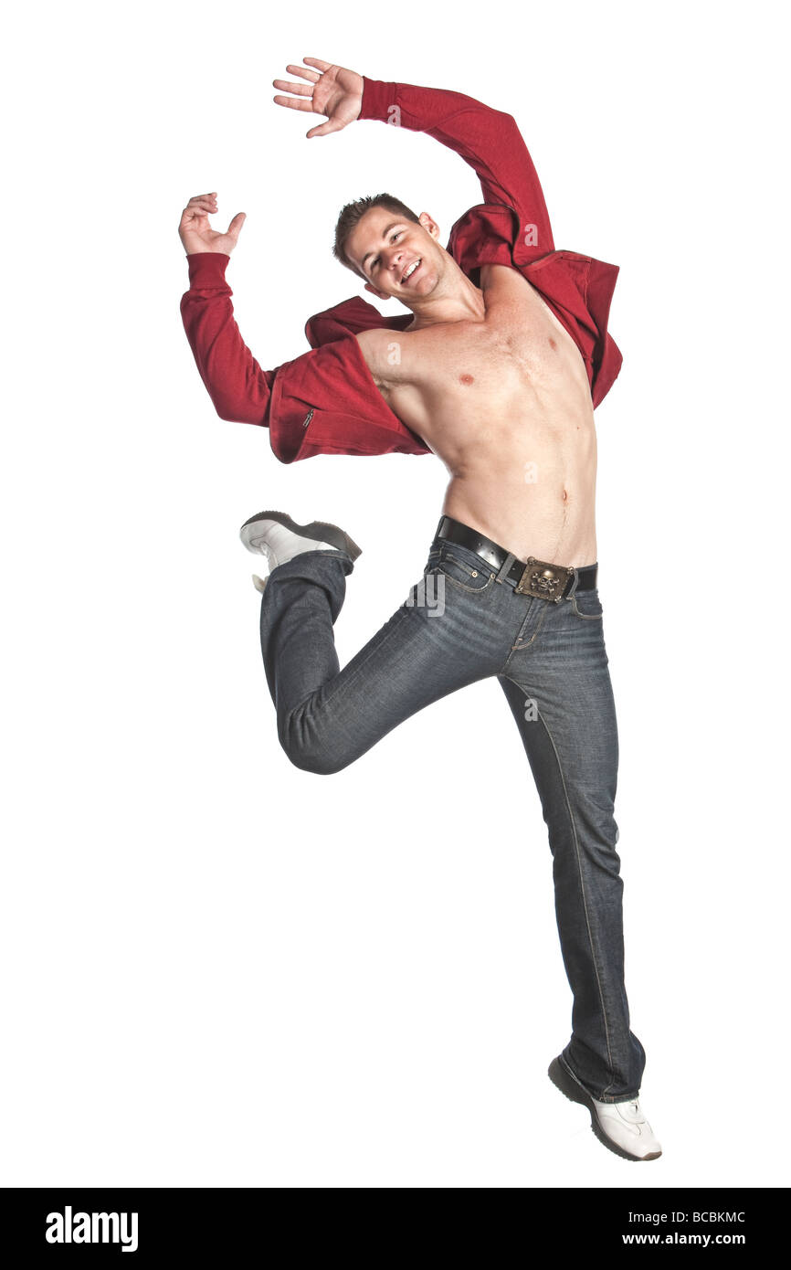A sexy open red shirt with blue jeans and white shoes caucasian with jumps  through the air in this action photo. well defined bo Stock Photo - Alamy
