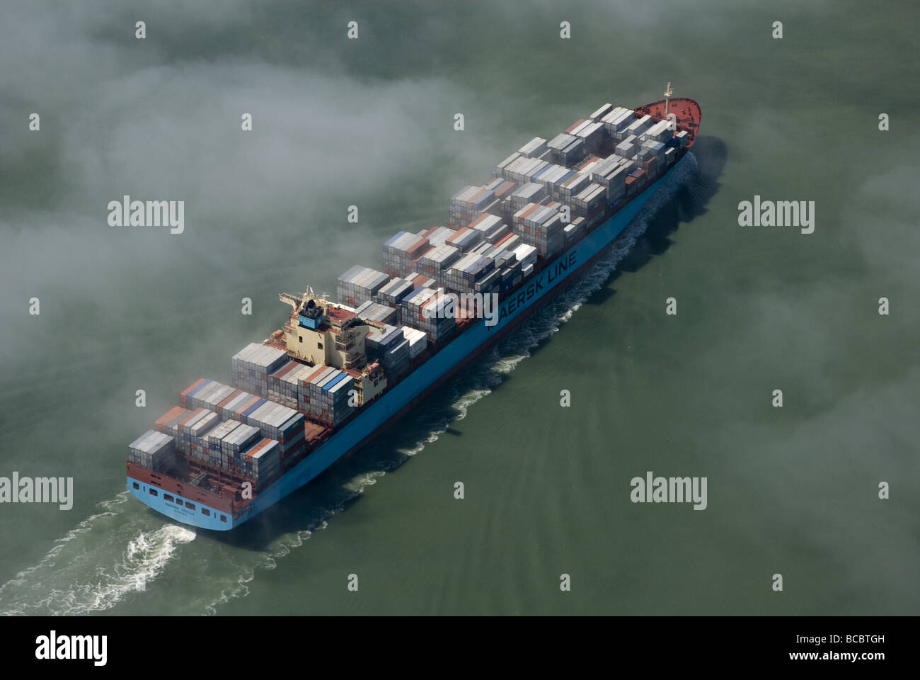 The Maersk Seville arriving at Felixstowe UK throught the sea fog Stock Photo