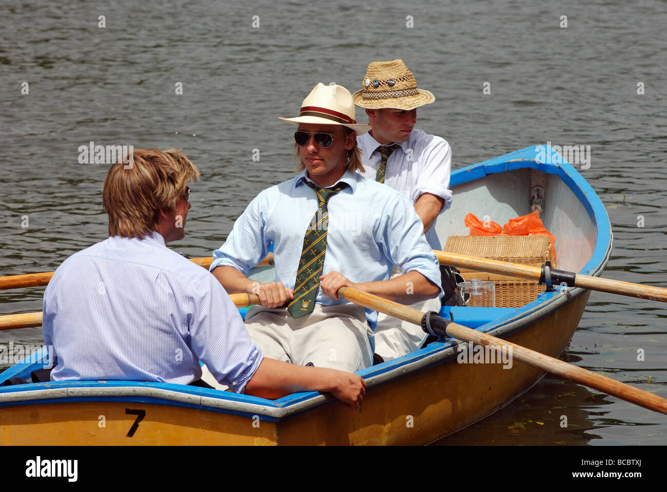 Young men in rowing boat at Henley Royal Regatta, HenleyonThames