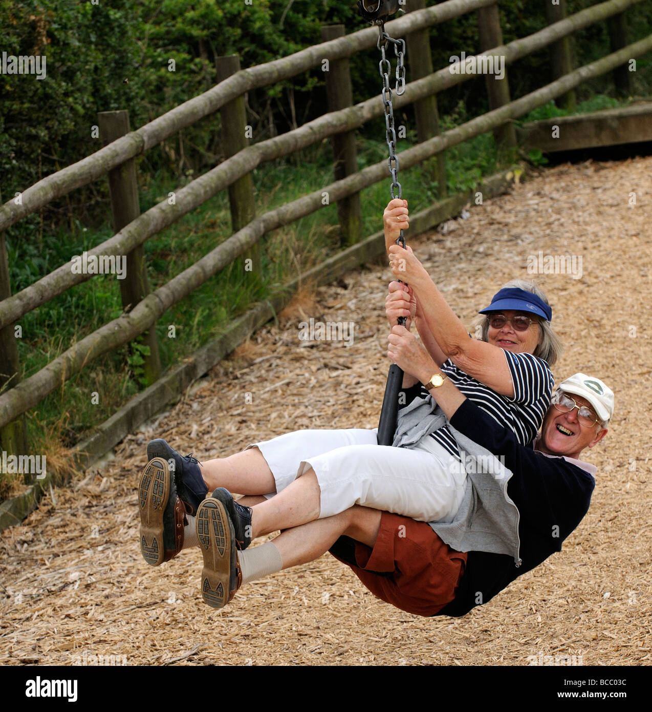 Elderly couple taking a zipline ride Stock Photo Alamy