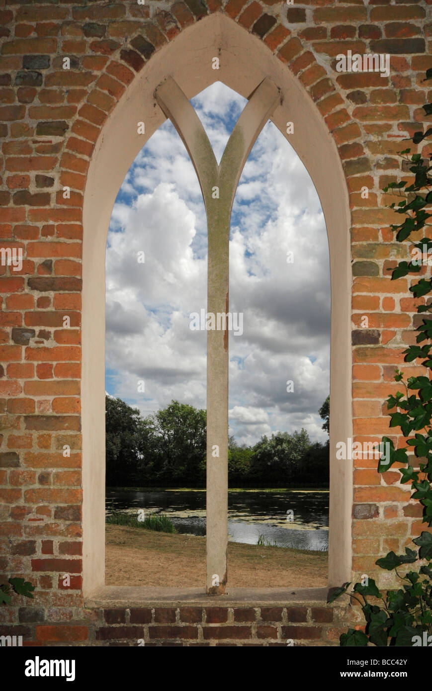 Arched window view onto a lake. Stock Photo