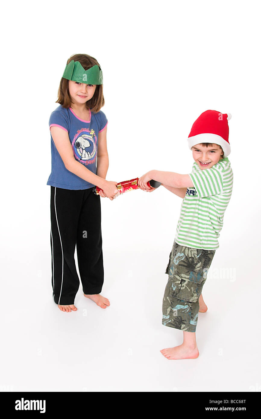 Young Children Pulling a Christmas Cracker Stock Photo