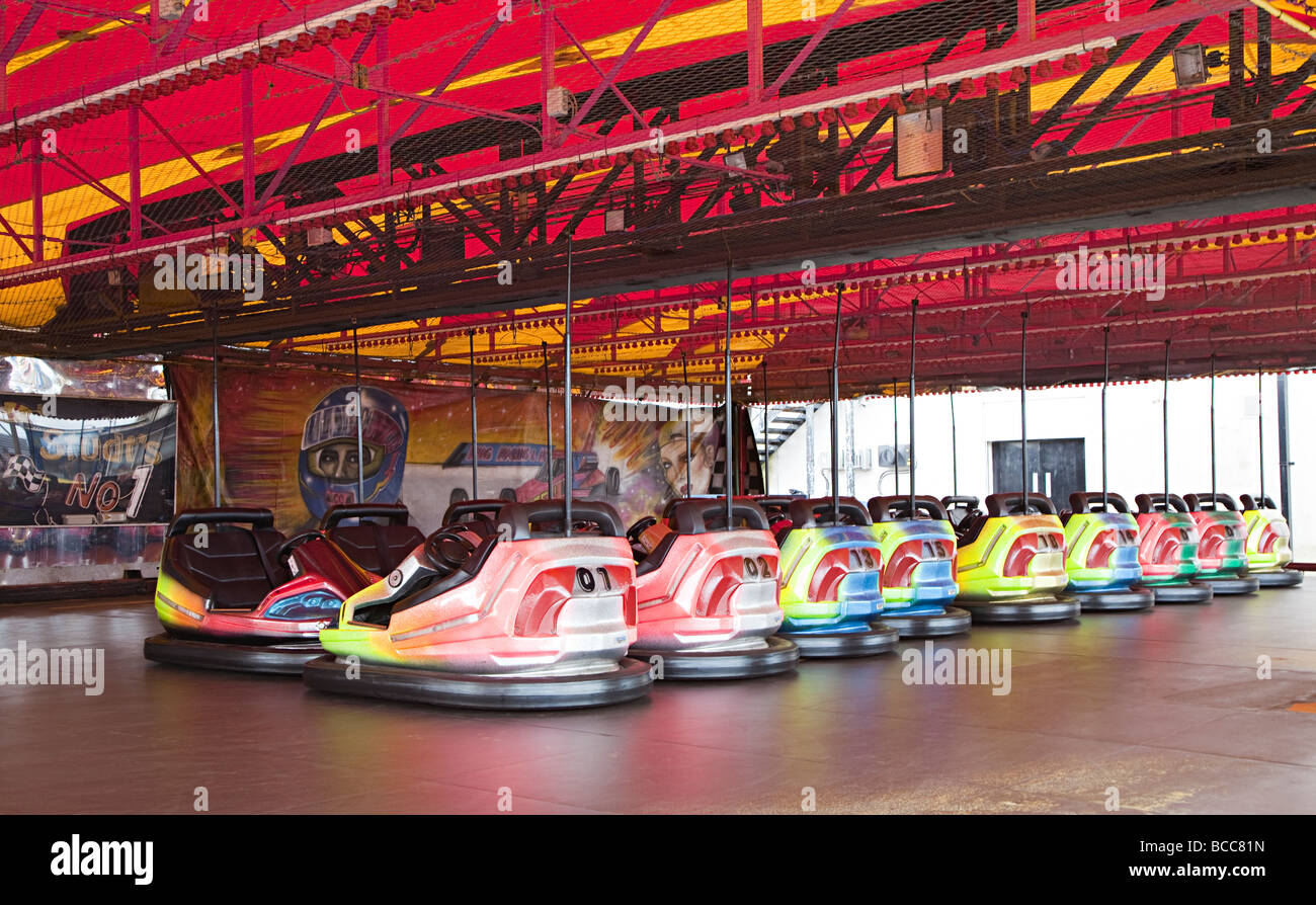 Dodgem bumper cars at funfair parked in row Barry Wales UK Stock Photo