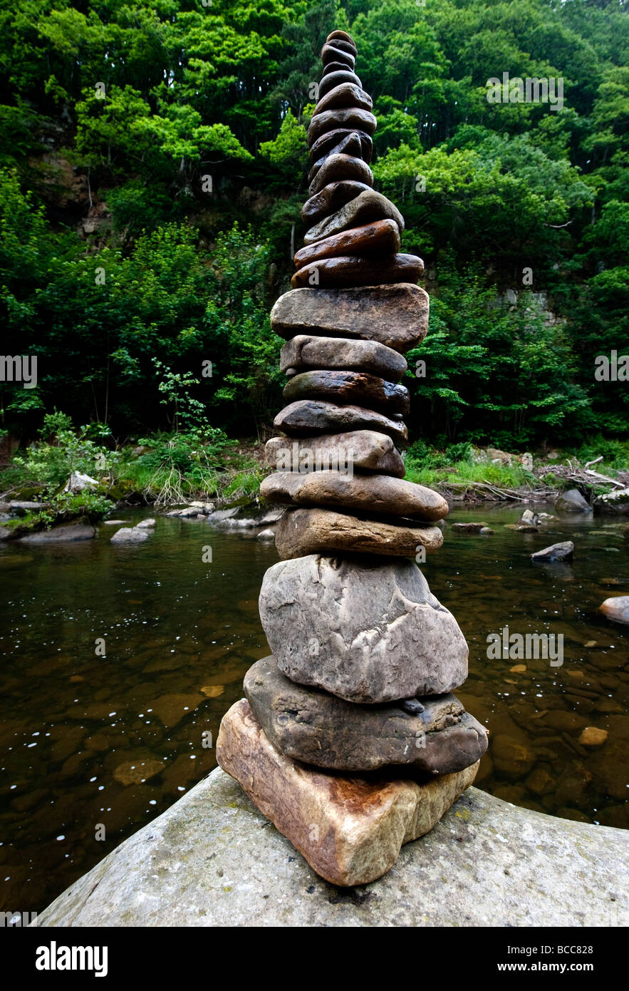 A collapsing pile of stones Stock Photo