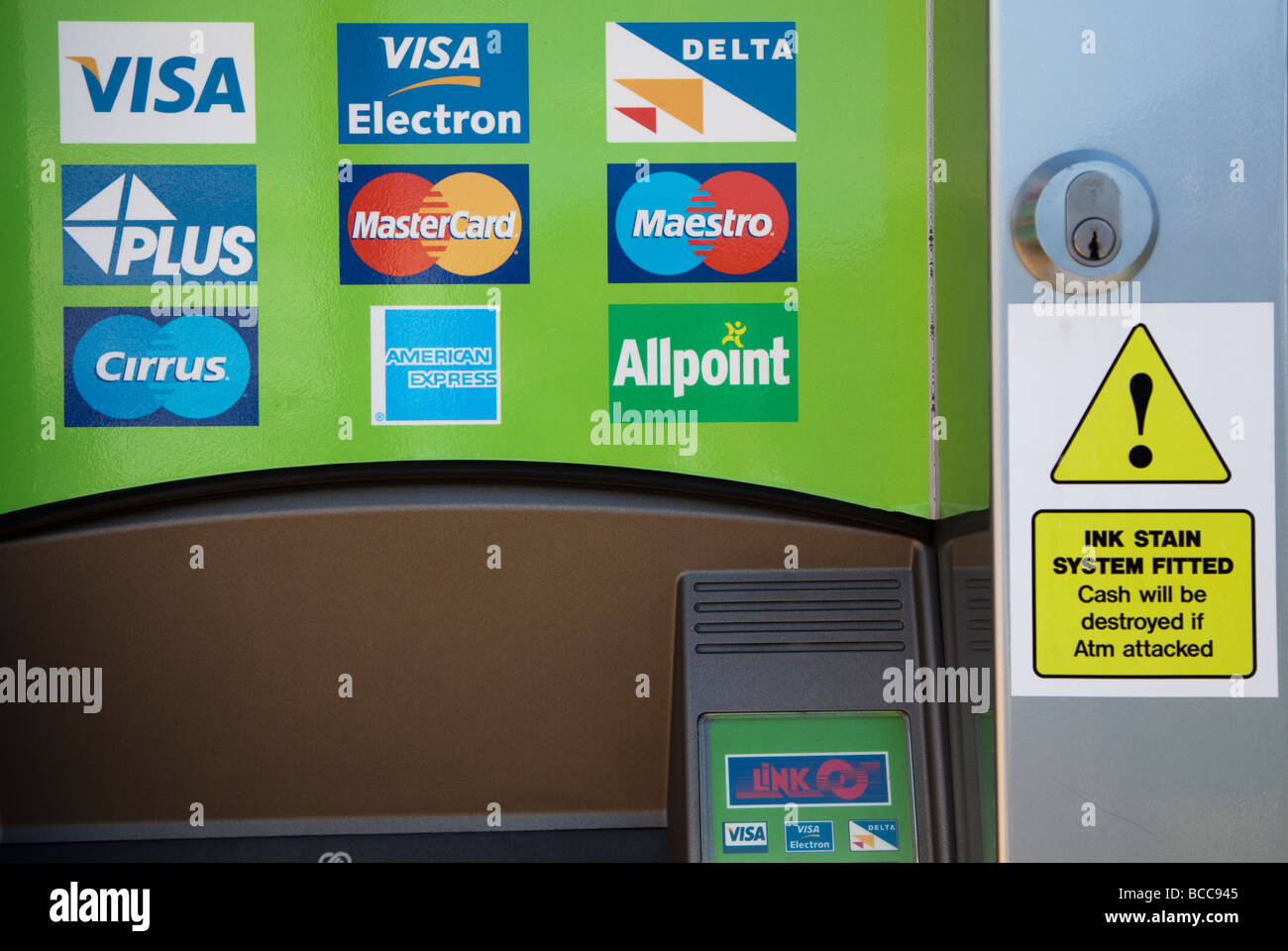 ATM with credit card signs and warning that ink system will destroy money if machine is attacked Barry Wales UK Stock Photo