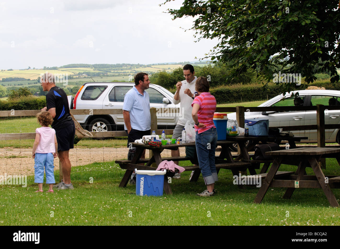 Picnicing at the Cotswold Farm Park in Guiting Power Gloucestershire England UK Stock Photo