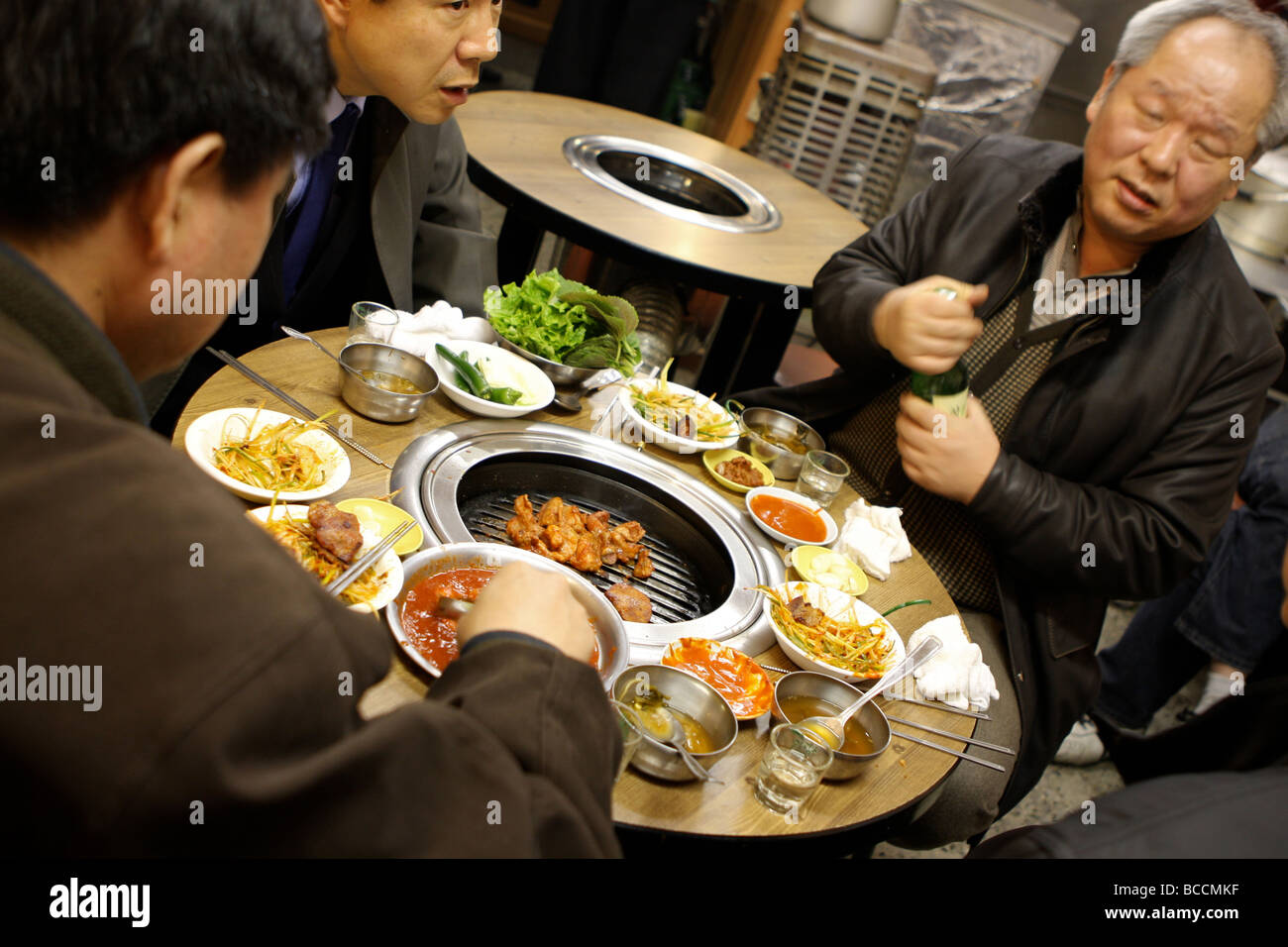 Koreans eating a Bulgogi, korean barbecue Stock Photo