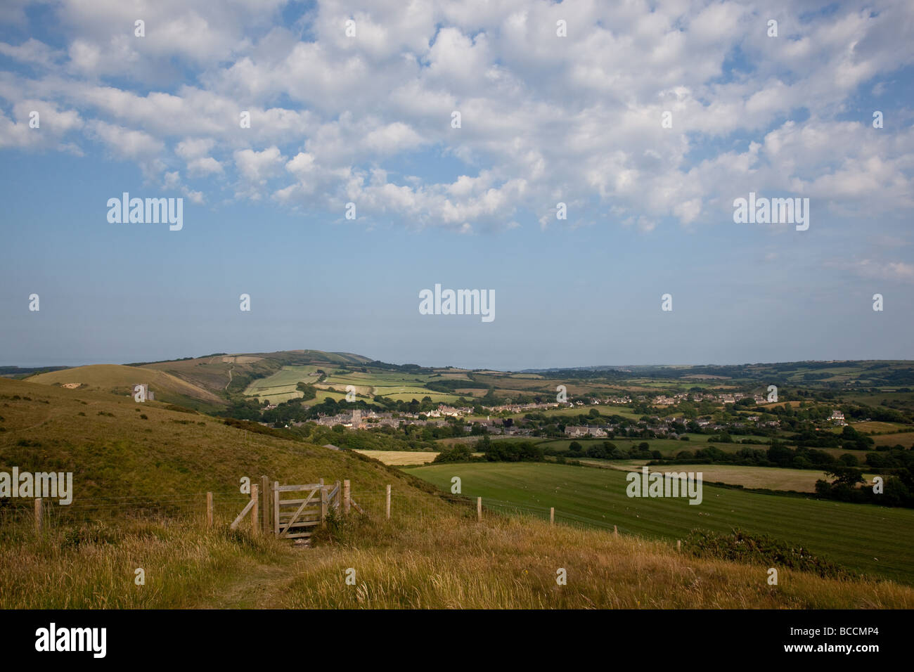 Looking towards Corfe Castle ruins and village as seen from the footpath on the Purbeck Hills, Dorset, England Stock Photo