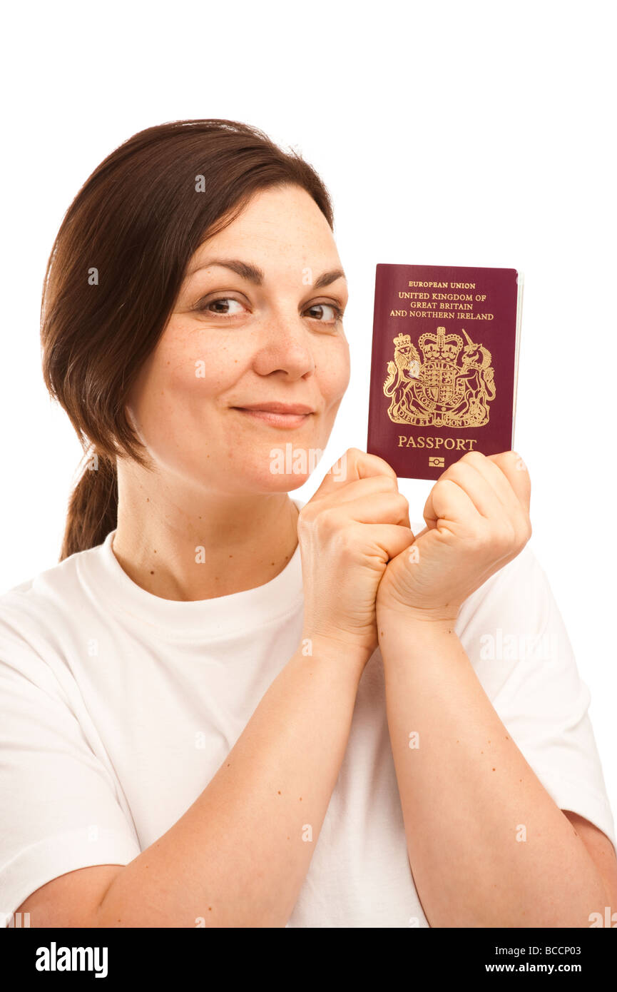 a young british citizen woman holding her UK passport Stock Photo