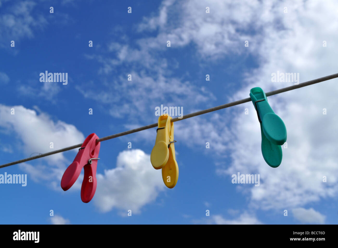 clothes pegs on washing line on a breezy windy day Stock Photo