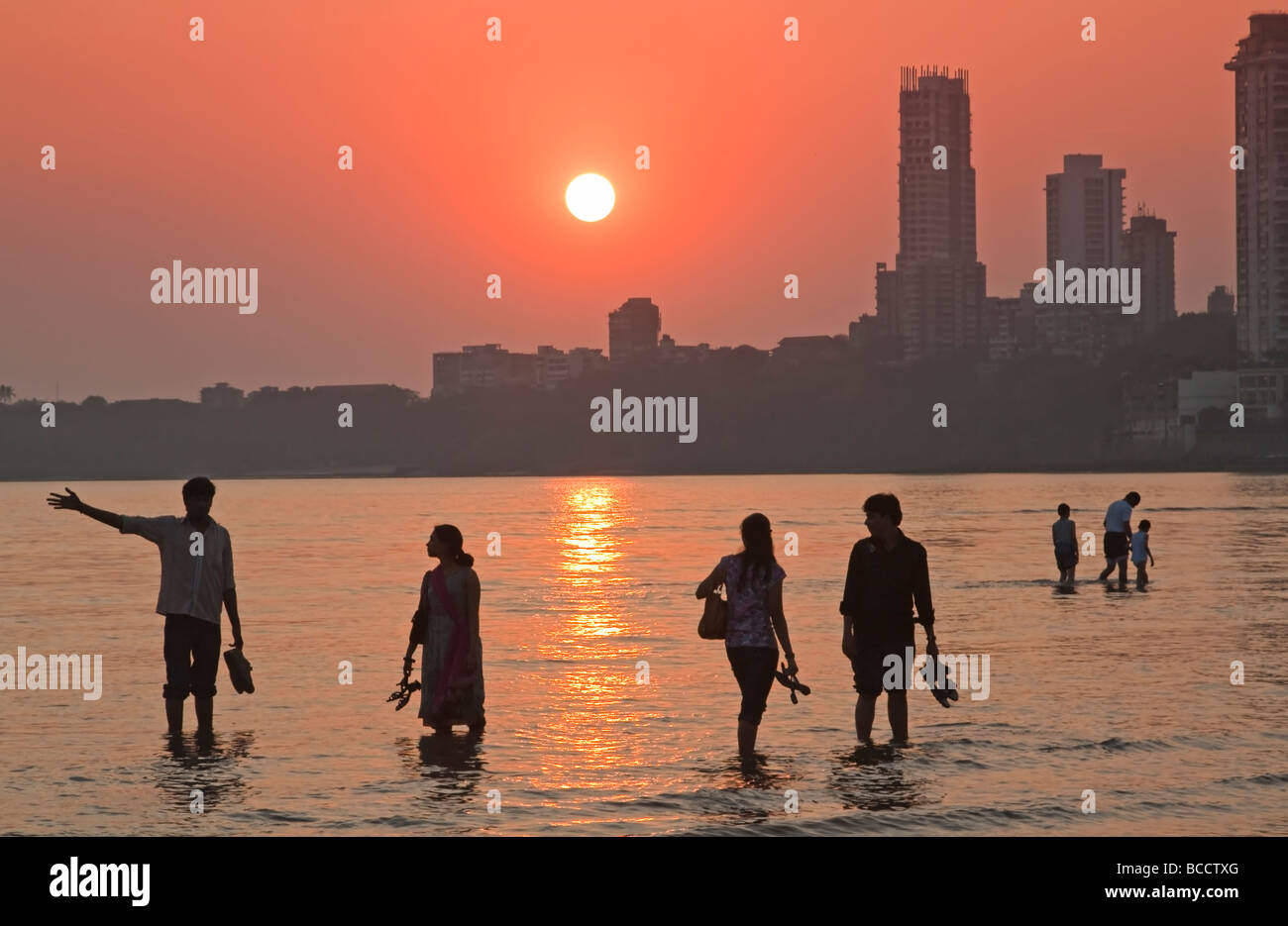 India Mumbai Bombay Chowpatty beach people on beach at sunset Stock Photo