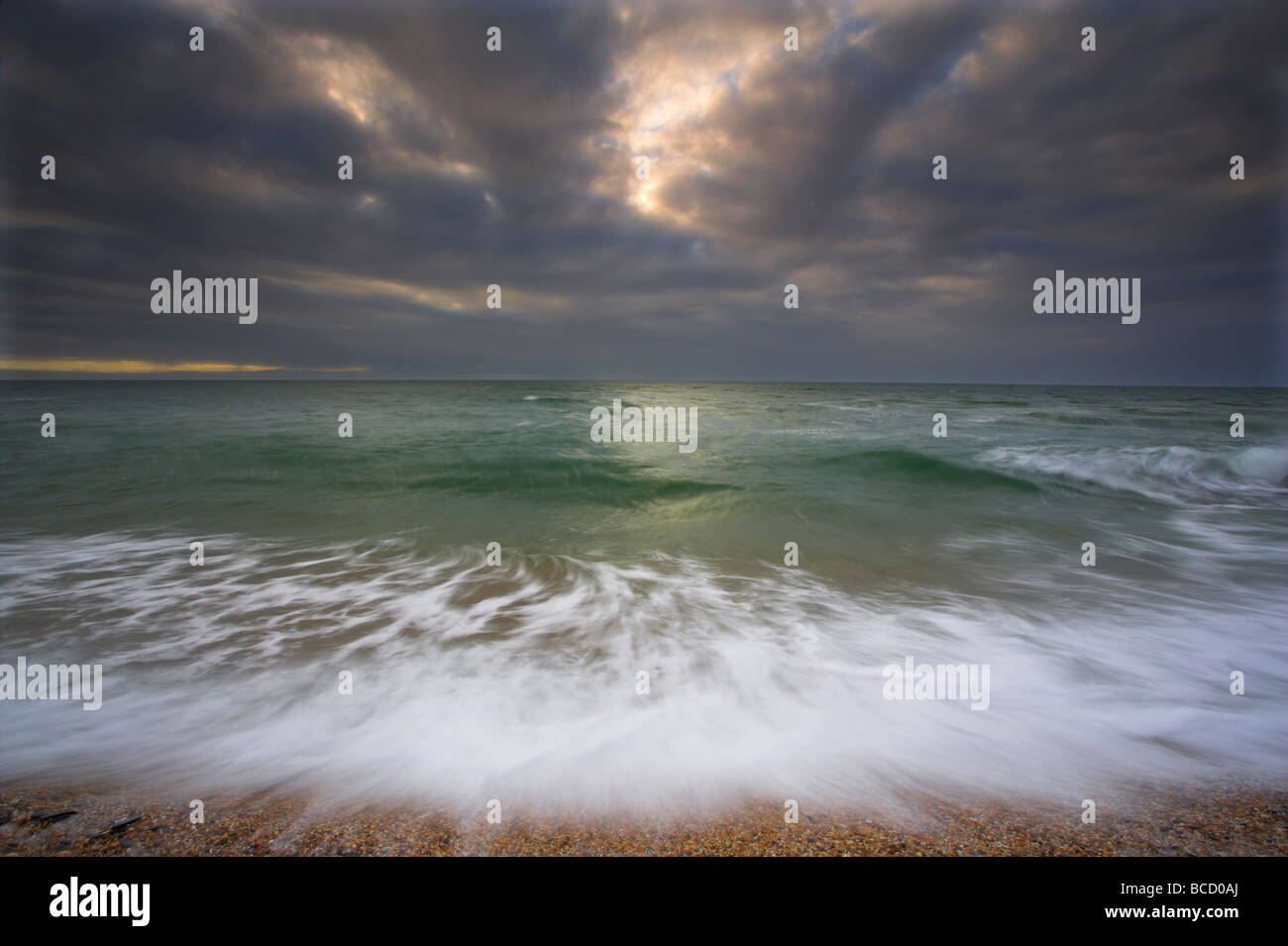Wave action and approaching storm. Slapton sands. Devon Stock Photo