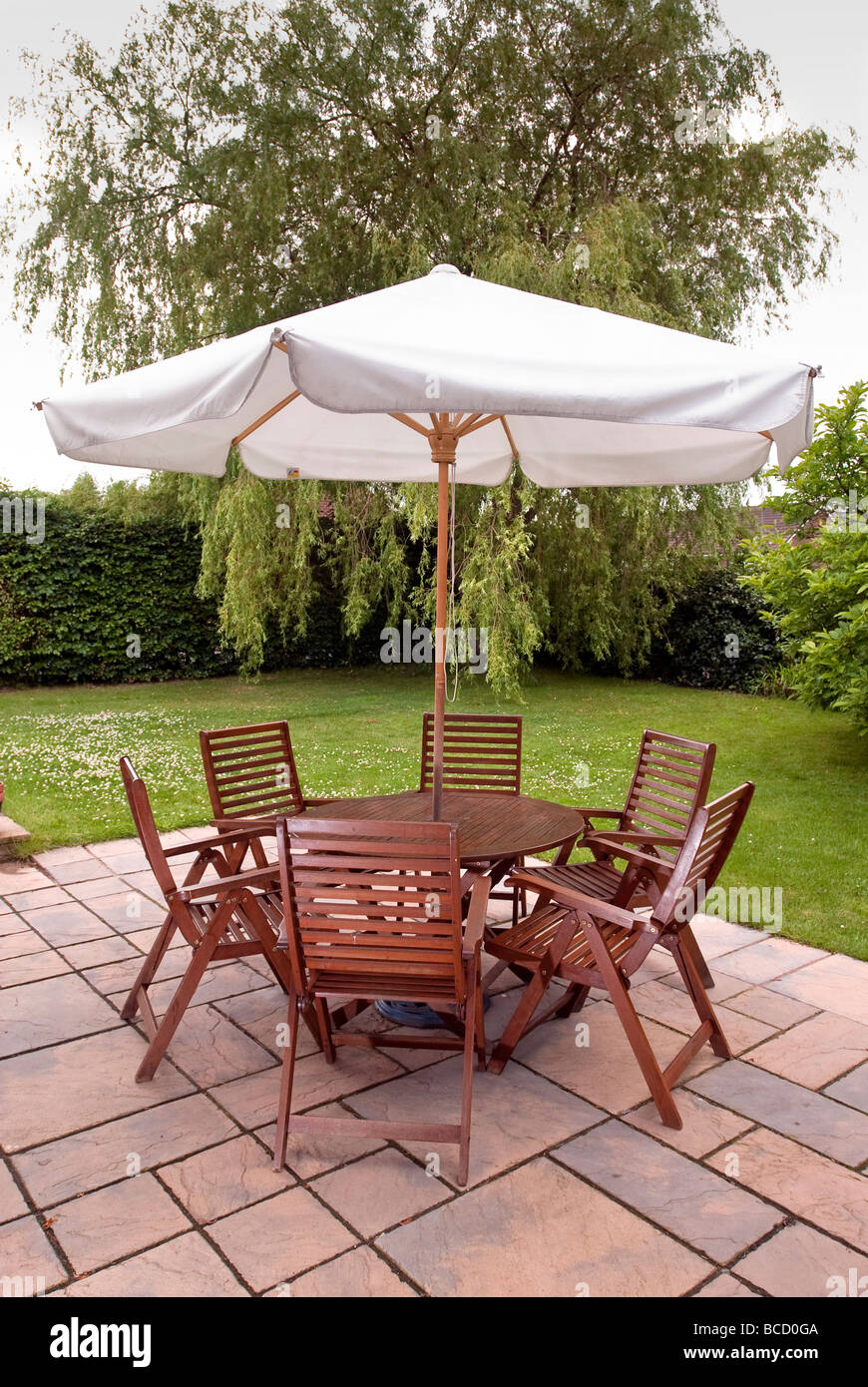 outdoor table with chairs and umbrella