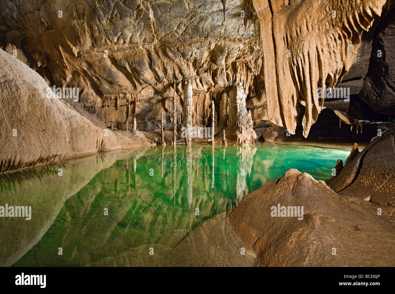 Stalagmites stalactites and subterranean lake. Krizna Jama karst cave system. Loska Dolina. Slovenia Stock Photo