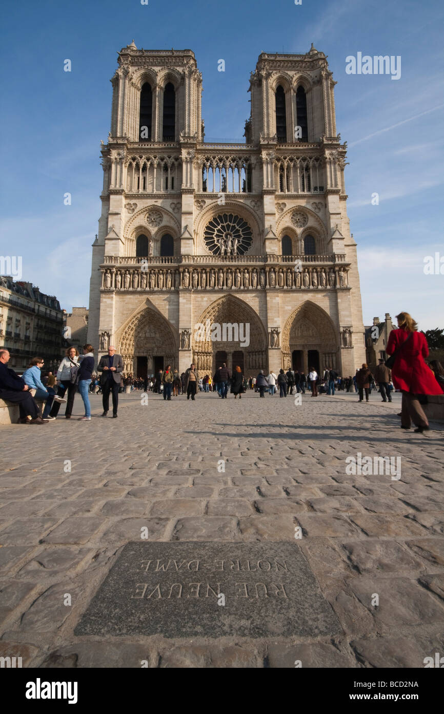 A view of Notre Dame and Street Plaque reading Rue Neuve Notre Dame on