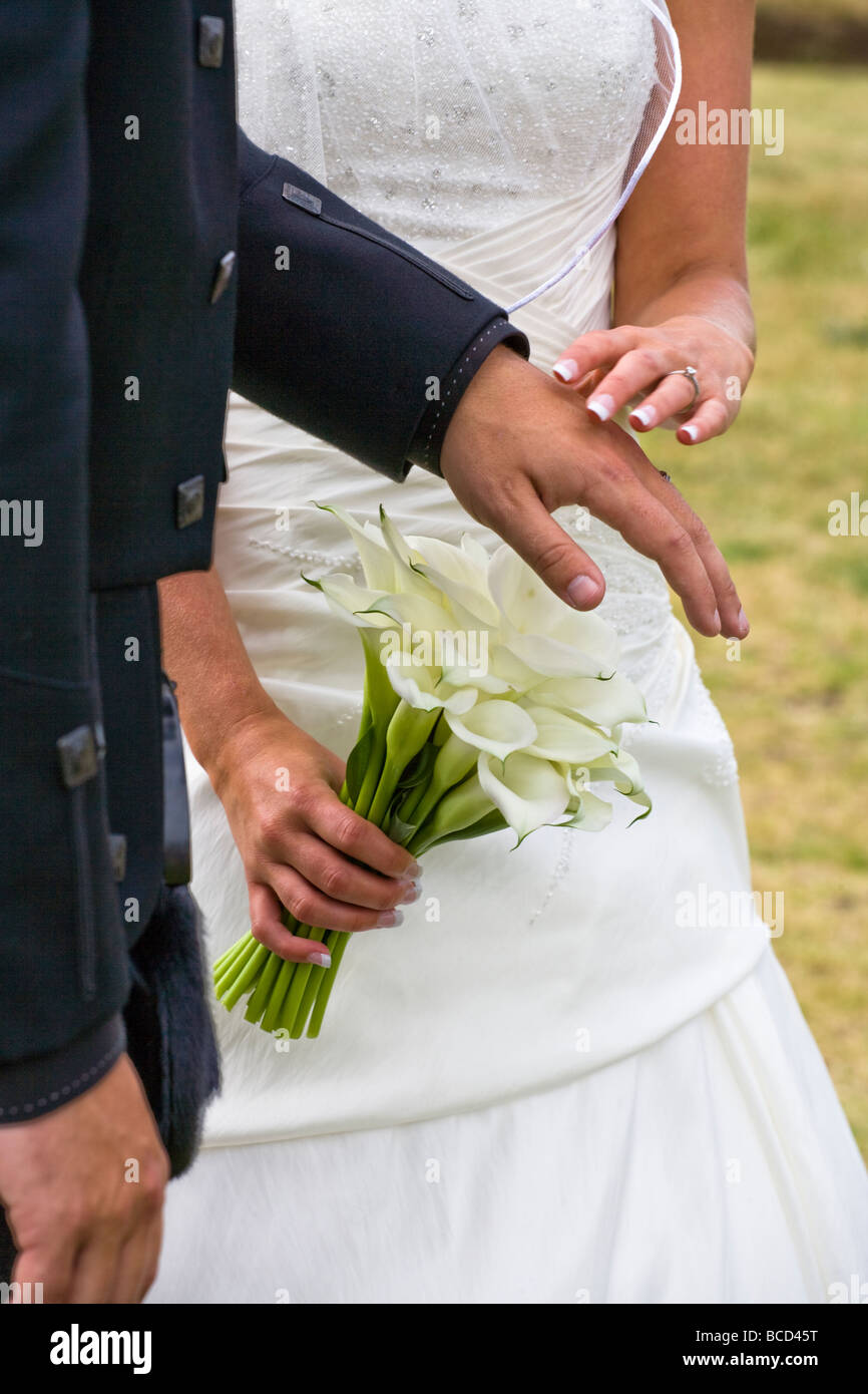 bride and groom touching Stock Photo