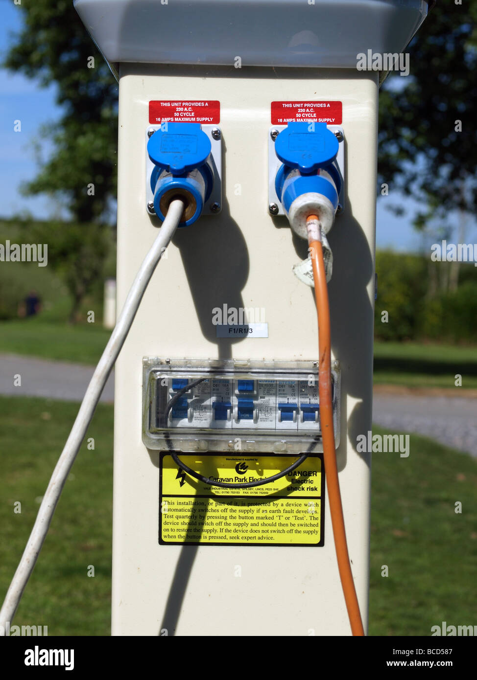 Electric hook-up point for caravans and tents at a camping site at Stoke  Fleming,Dartmouth,Devon Stock Photo - Alamy