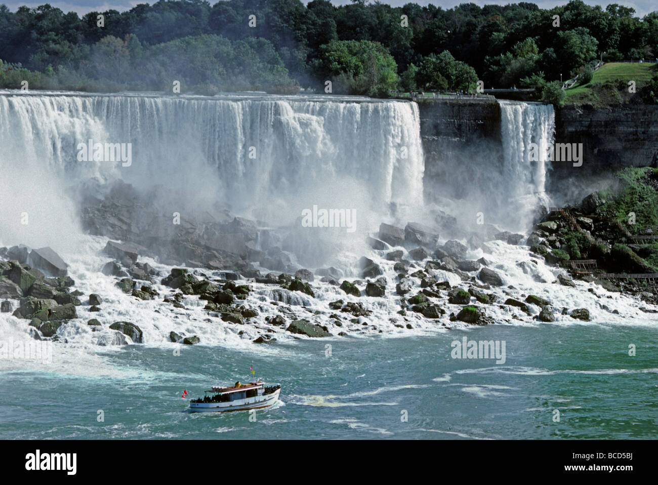 TOUR BOAT taking tourists for up close view of NIAGARA FALLS NEW YORK