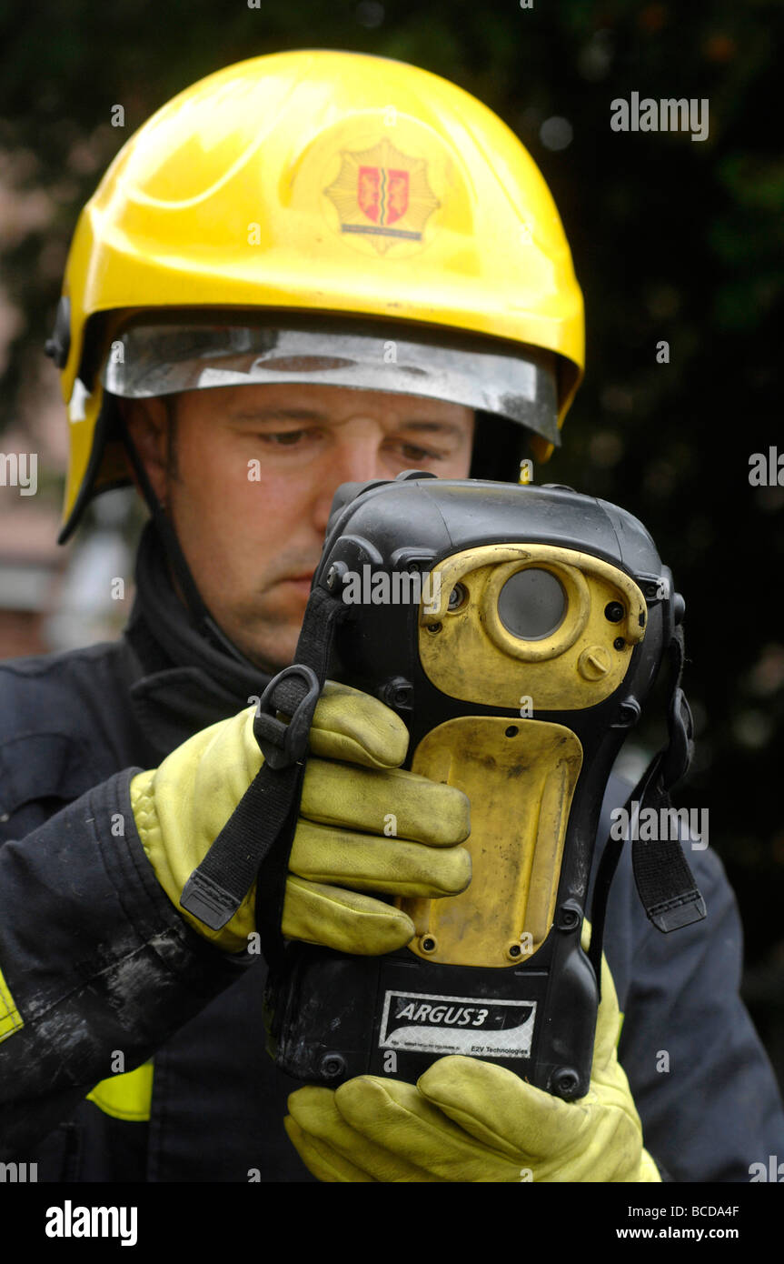 Fireman using a 'thermal imaging camera' , Britain UK Stock Photo