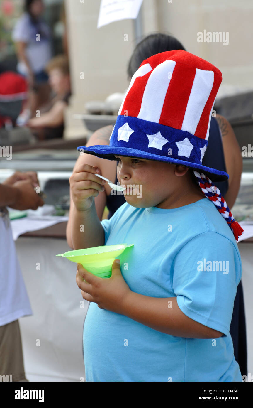 Obese child eating ice cream Stock Photo