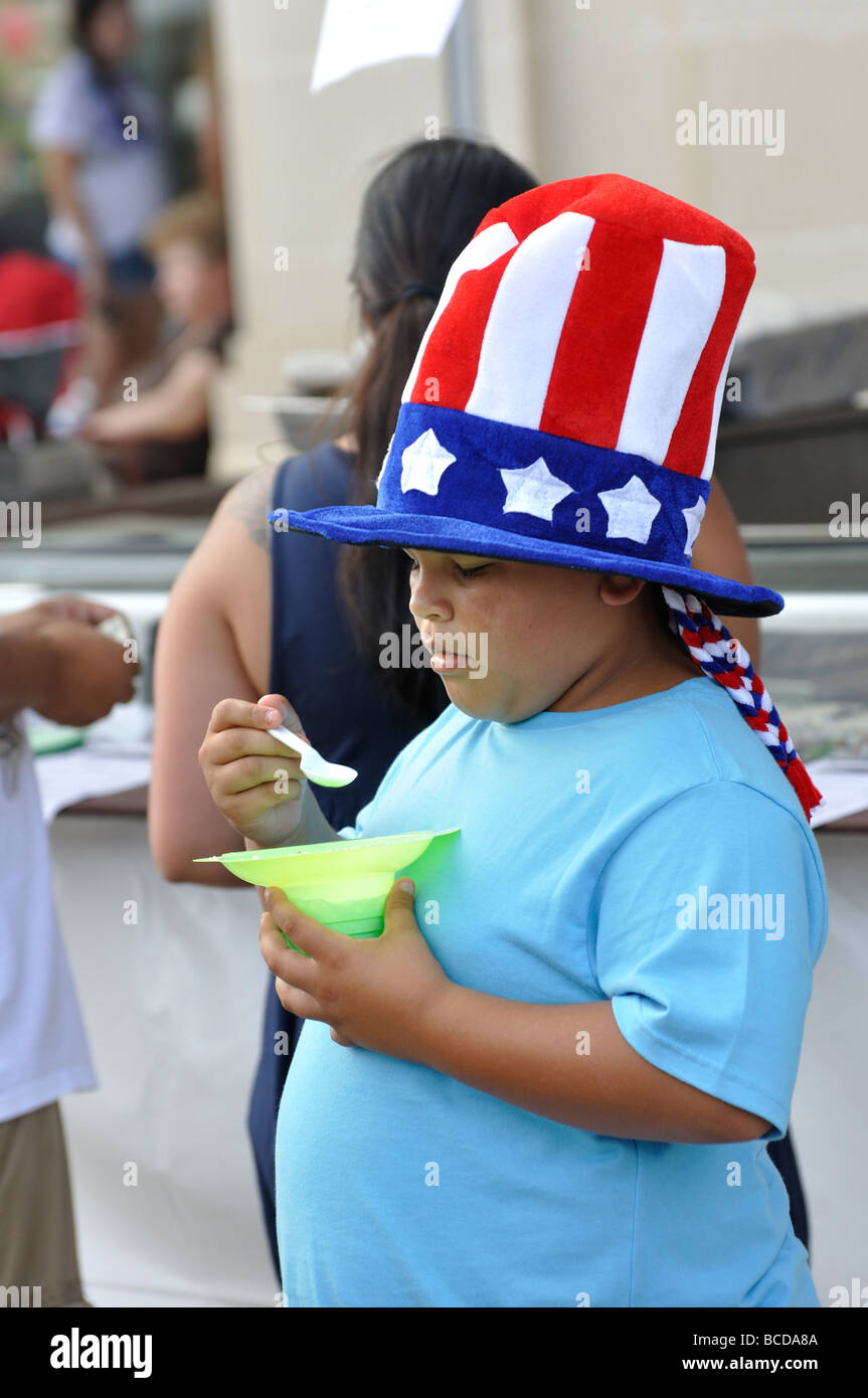 Obese child eating ice cream Stock Photo