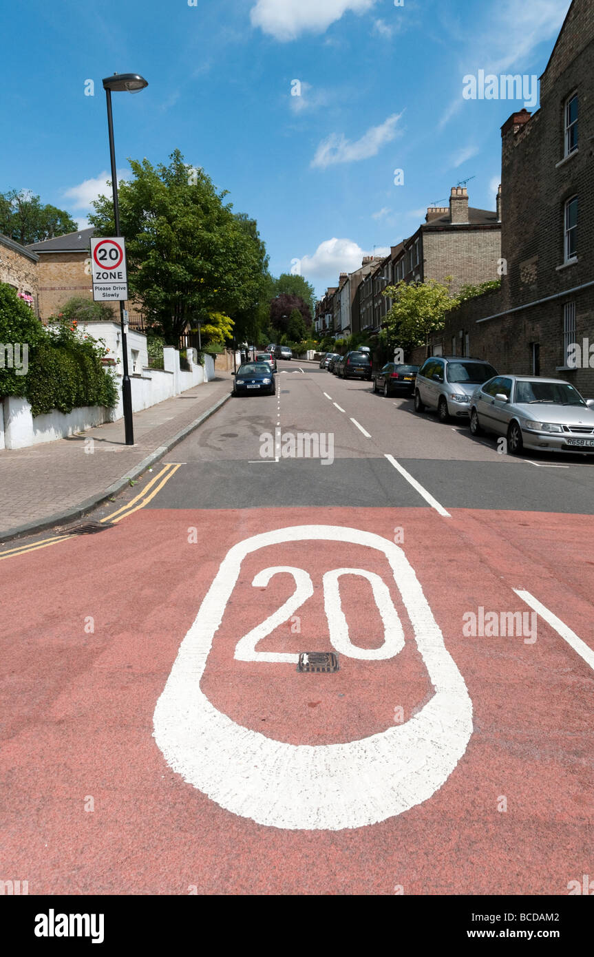 20 MPH speed limit road marking in residential street, London England