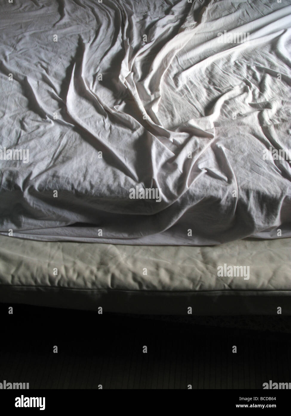 creases on bed sheet in dark room Stock Photo Alamy