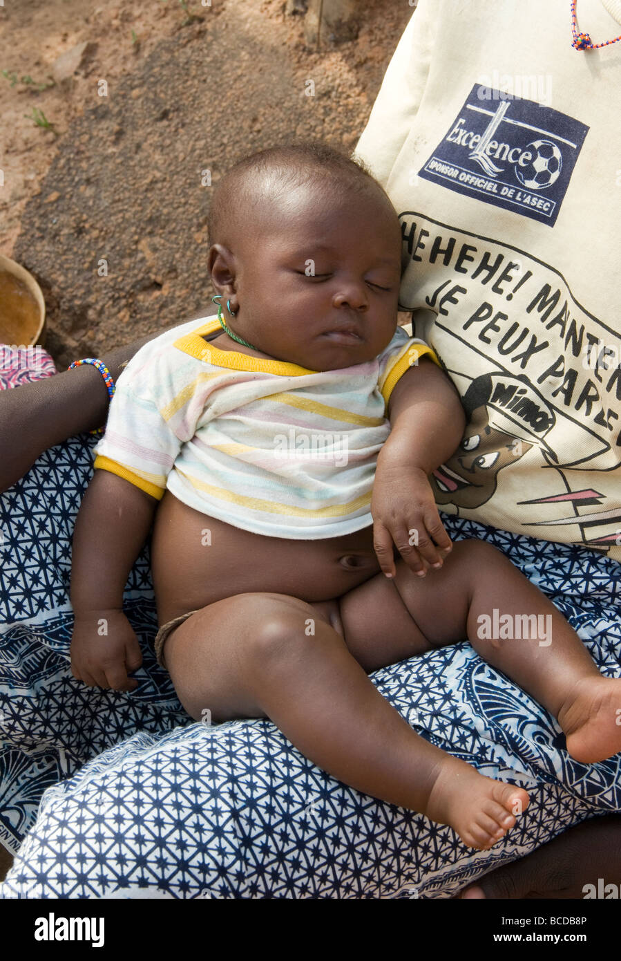 Burkina Faso. Lobi country. Baby with her mother. Stock Photo