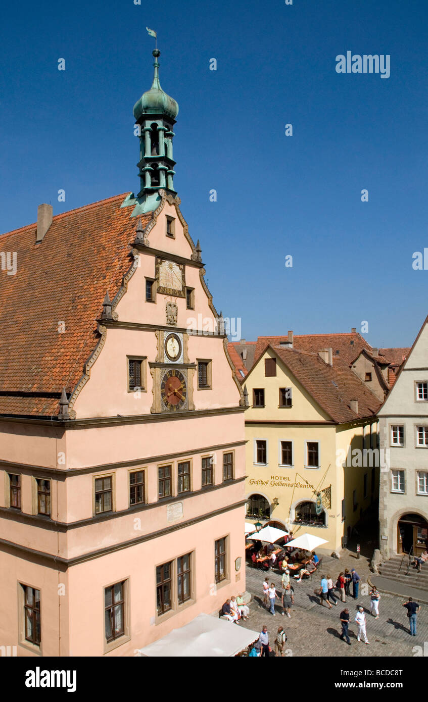 Rothenburg ob der Tauber's Ratstrinkstube (City Councilor's Tavern) with clocks and sundial overlooking old town Markt Square Stock Photo