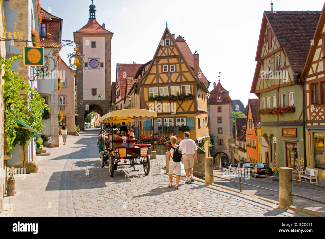 Rothenburg ob der Tauber's Plonlein (Little Square) with Siebers Town Tower & town gate with clock (upper street) & Kobolzeller Stock Photo