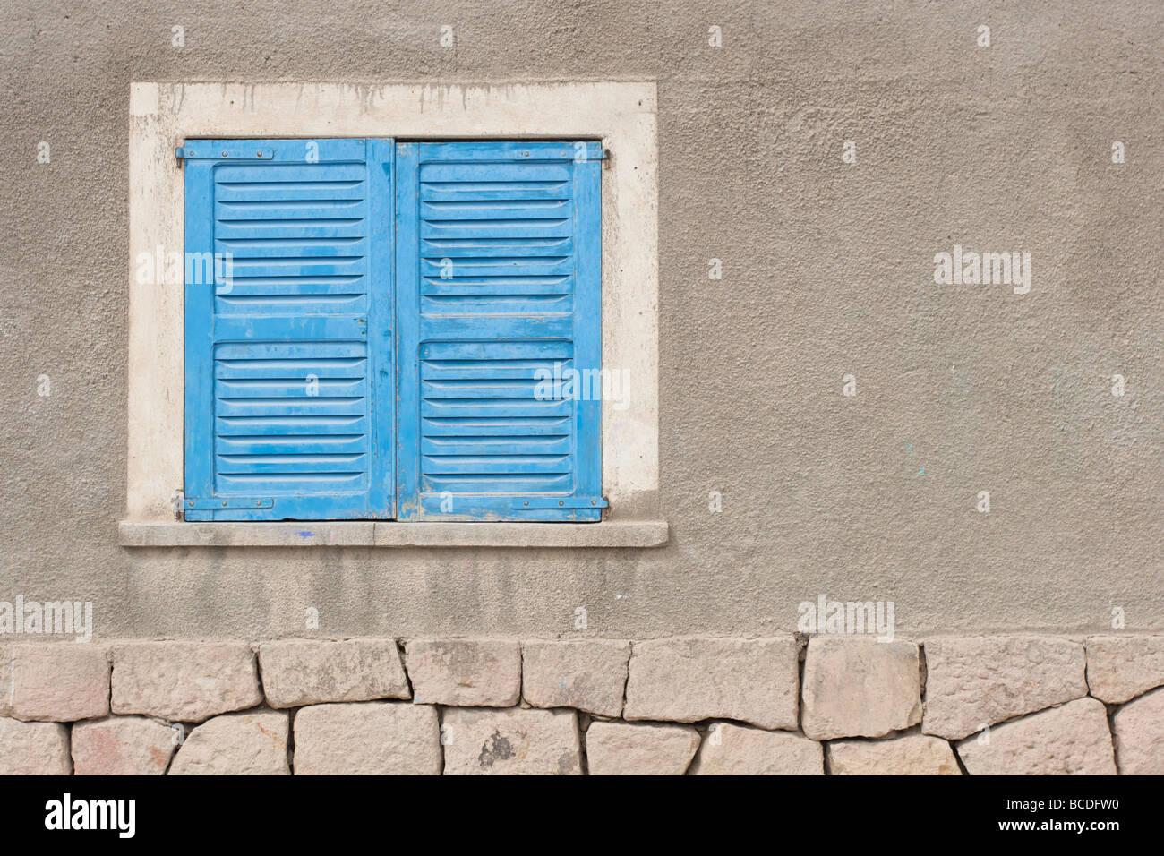 Bright blue window shutters in the small mining town of San Antonio de los Cobres, in northern Argentina. Stock Photo