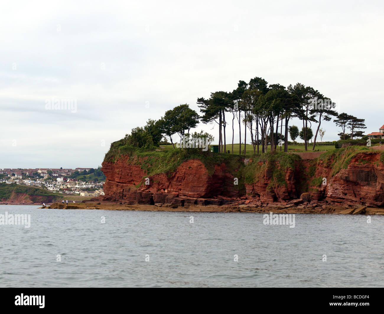 The red cliffs and rocky shore,between Paignton and Goodrington. Stock Photo