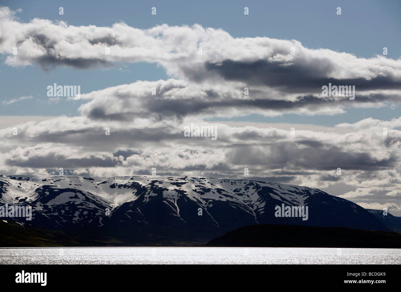 A view of snow capped mountains from the ferry to Grímsey Island, Iceland Stock Photo
