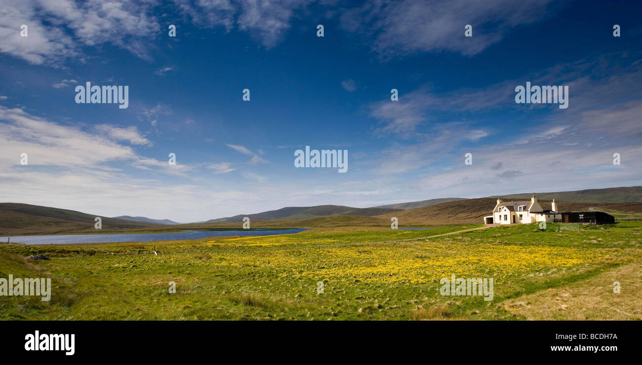 Croft house by Sandwater Loch, Shetland Islands Stock Photo