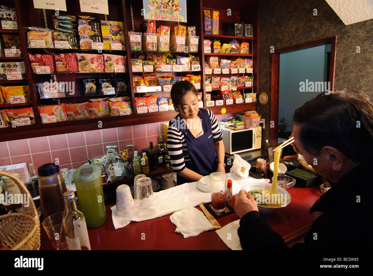 Customer enjoying noodles, Sakura instant ramen restaurant, Tokyo, Japan, 4 December 2008. Stock Photo
