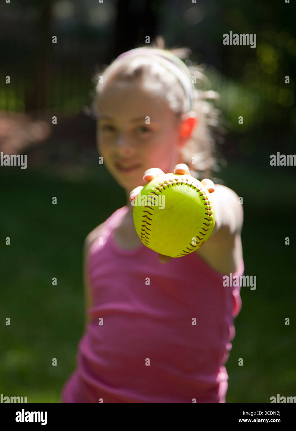 Child holding a softball Stock Photo Alamy