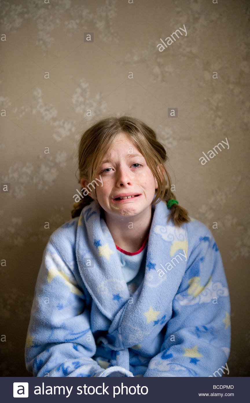 A 10yearold girl cries in her pajamas Stock Photo 24889437 Alamy