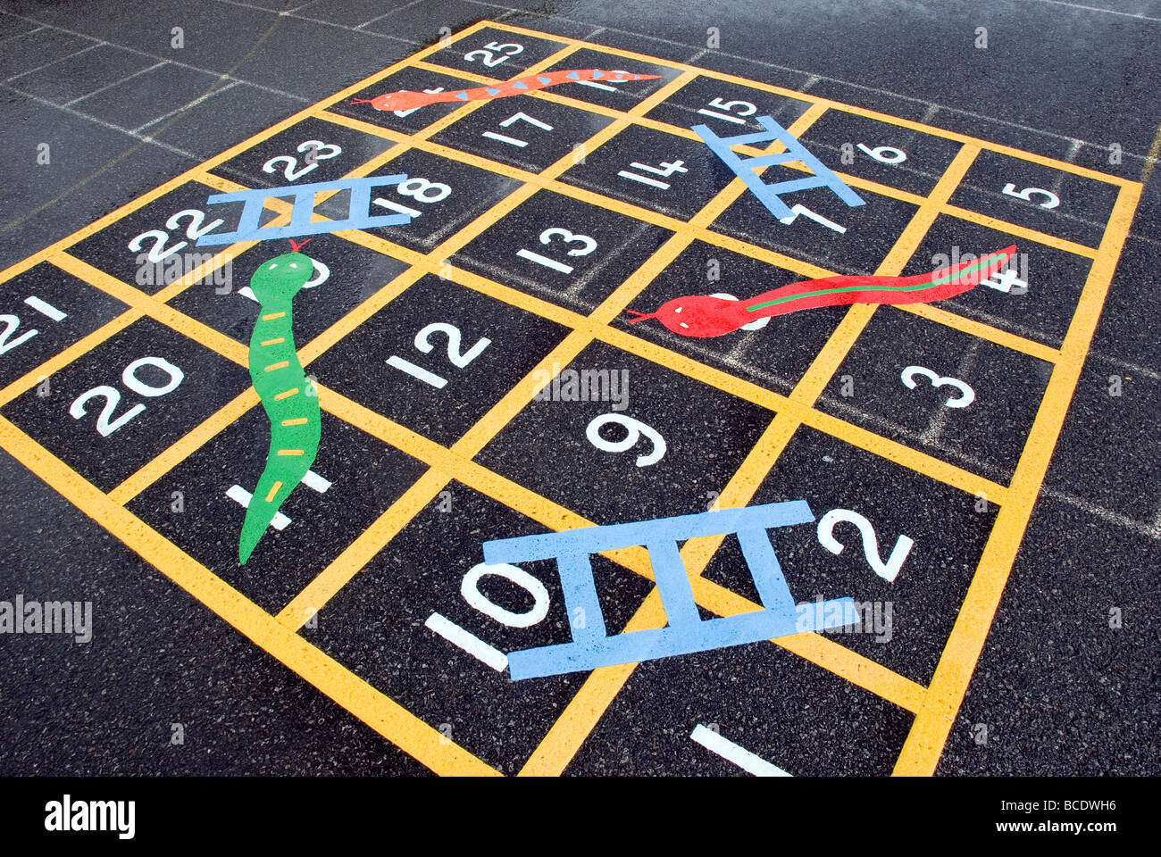 Snakes and ladders in school playground,activity, blue, british