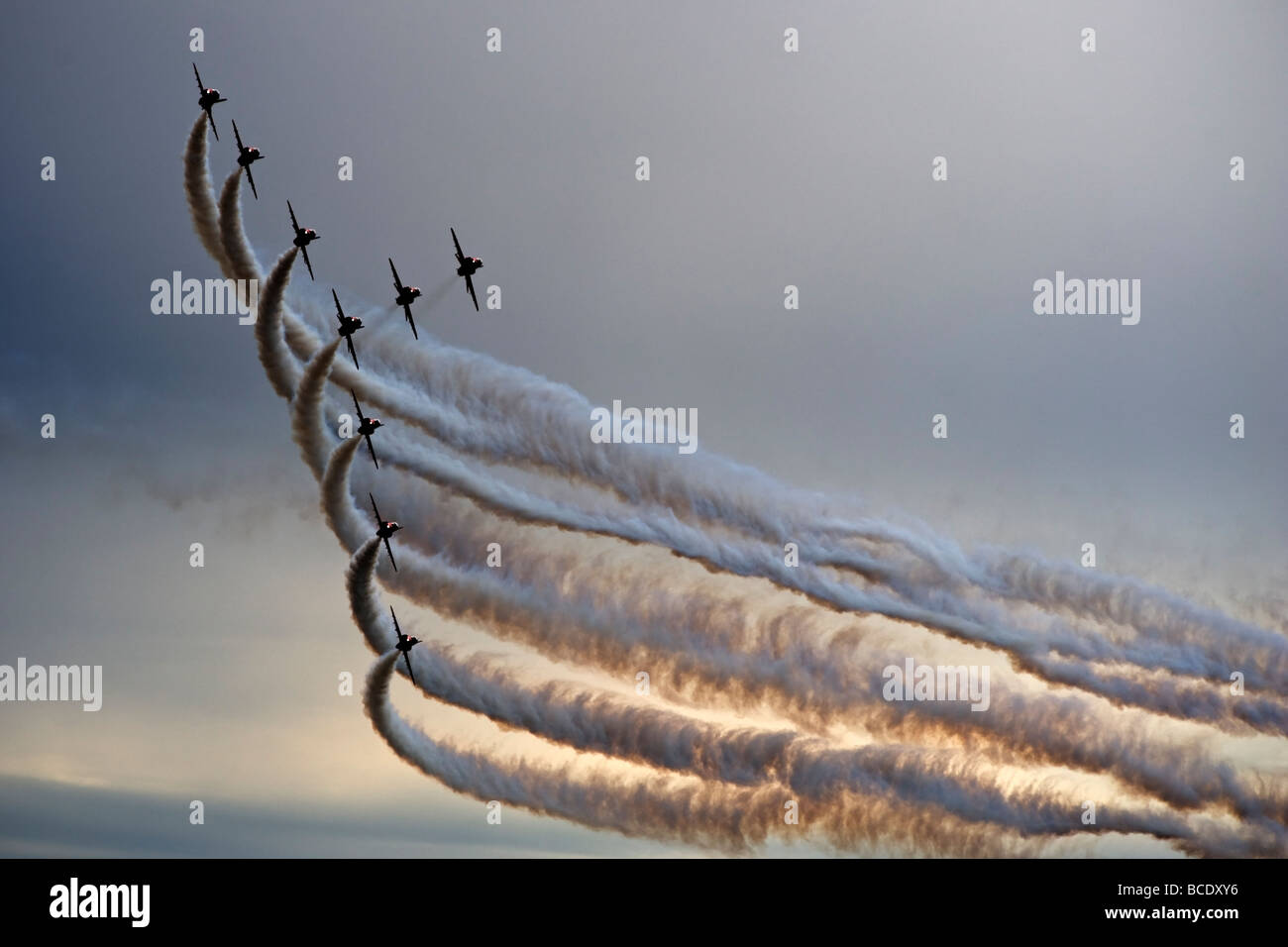 The RAF Red Arrows Display Team perform against a stormy sky at Biggin Hill in July 2009. Stock Photo