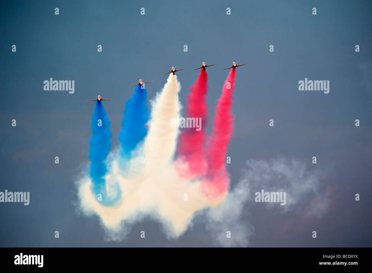 The RAF Red Arrows Display Team perform against a stormy sky at Biggin Hill in July 2009. Stock Photo