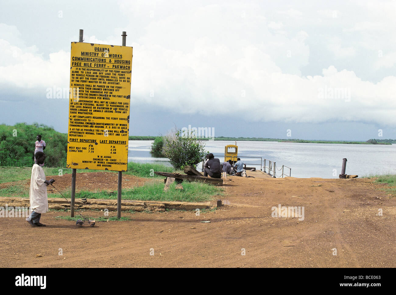 The Pakwach free vehicle ferry on River Nile at Port Masindi Uganda East Africa with Ministry of Works Notice board Stock Photo