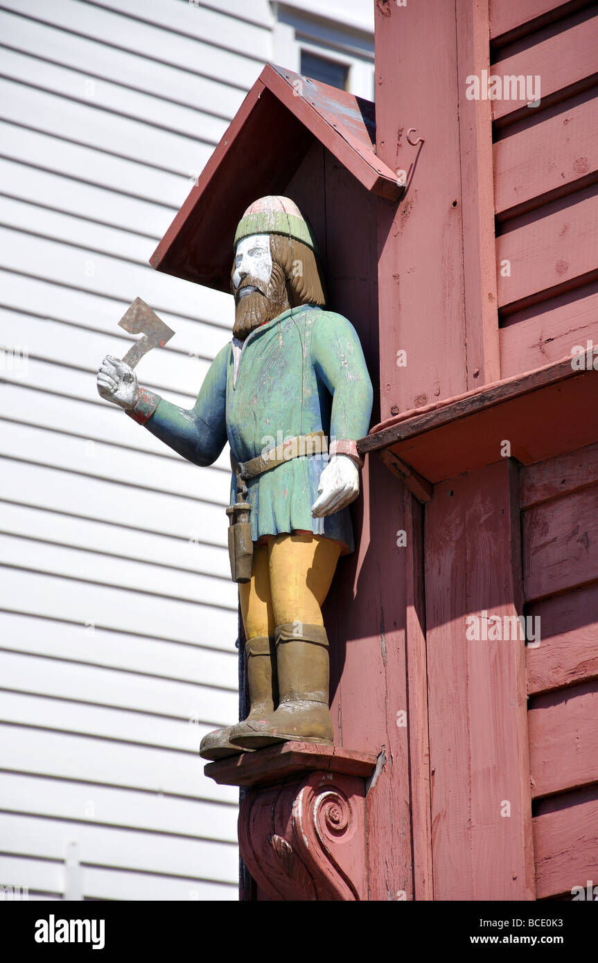 Carved wooden statue, 18th Century wooden warehouses, Bryggen, Bergen, Hordaland, Norway Stock Photo