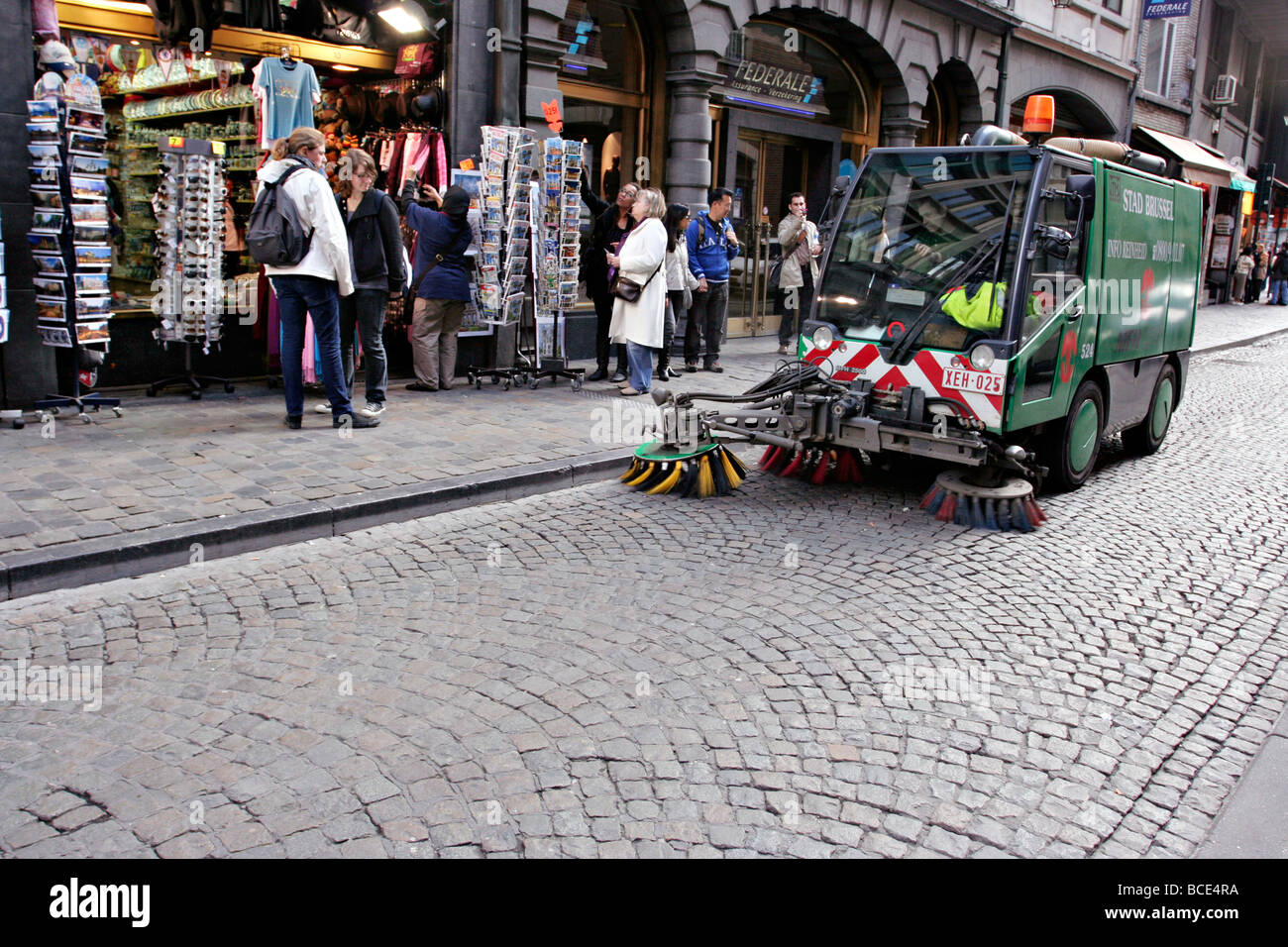 Cleaning up cobble stone street in Brussel, Belgium. Stock Photo